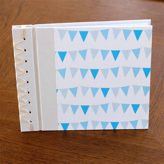 baby's first book - blue bunting by rag & bone bindery