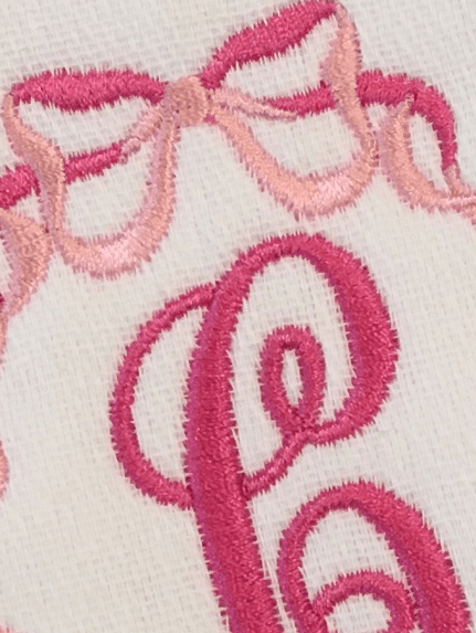 embroidered initial burp cloth with bows