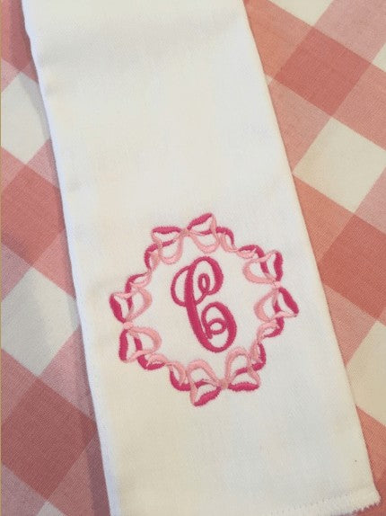 embroidered initial burp cloth with bows