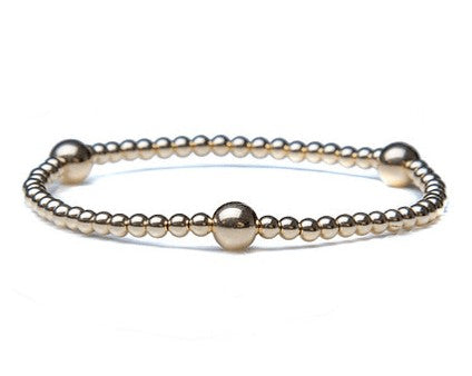 14k gold bracelet with 3 accent balls and beads
