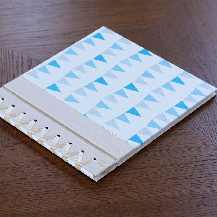 baby's first book - blue bunting by rag & bone bindery