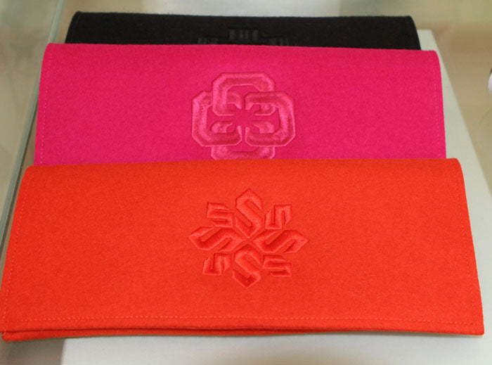 monogram felt clutch