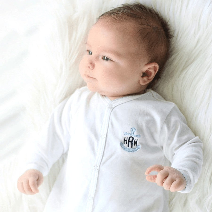 White with baby blue trim footie with anchor monogram